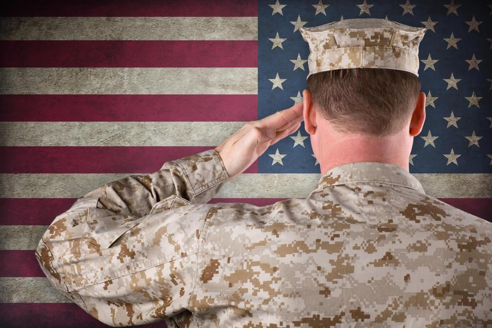 soldier saluting flag